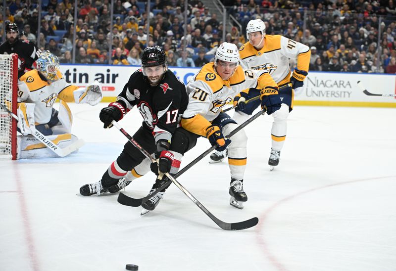 Jan 31, 2025; Buffalo, New York, USA; Buffalo Sabres left wing Jason Zucker (17) and Nashville Predators defenseman Justin Barron (20) battle for the puck in the second period at the KeyBank Center. Mandatory Credit: Mark Konezny-Imagn Images