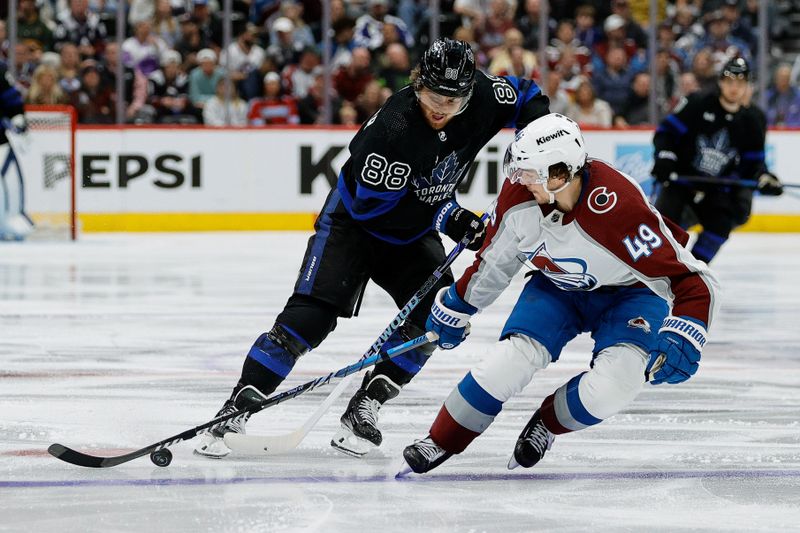 Feb 24, 2024; Denver, Colorado, USA; Toronto Maple Leafs right wing William Nylander (88) and Colorado Avalanche defenseman Samuel Girard (49) battle for the puck in the third period at Ball Arena. Mandatory Credit: Isaiah J. Downing-USA TODAY Sports