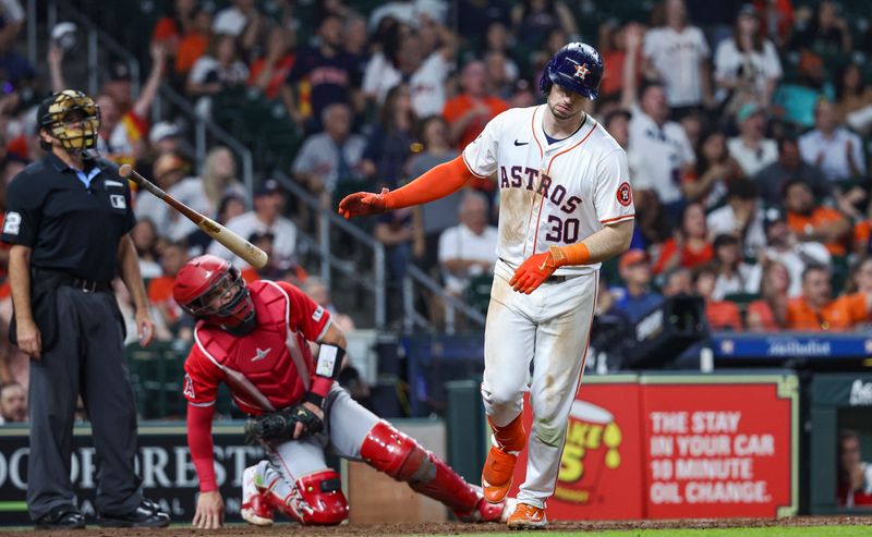 May 21, 2024; Houston, Texas, USA; Houston Astros right fielder Kyle Tucker (30) tosses his bat down after hitting a home run during the seventh inning against the Los Angeles Angels at Minute Maid Park. Mandatory Credit: Troy Taormina-USA TODAY Sports