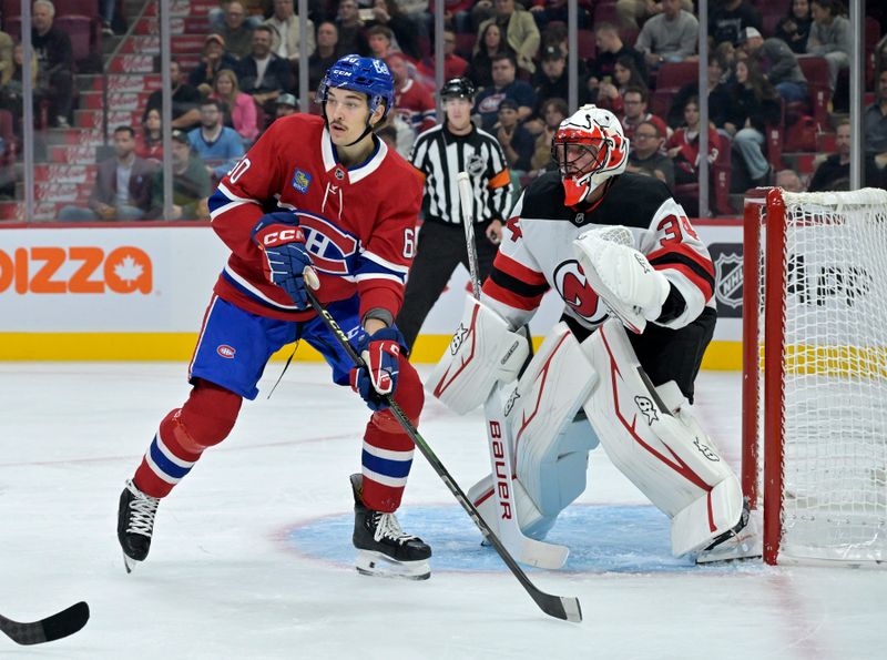 Sep 24, 2024; Montreal, Quebec, CAN; Montreal Canadiens forward Florian Xhekaj (60) screens New Jersey Devils goalie Jake Allen (34) during the first period at the Bell Centre. Mandatory Credit: Eric Bolte-Imagn Images