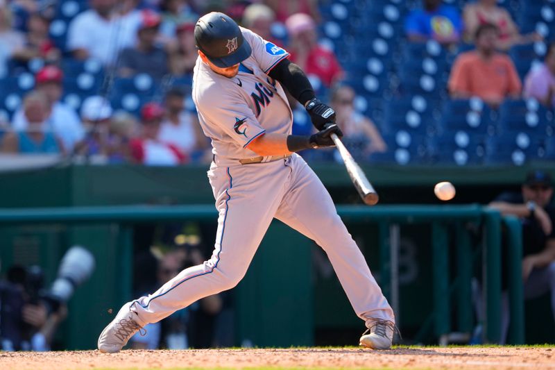 Sep 3, 2023; Washington, District of Columbia, USA;  Miami Marlins designated hitter Jake Burger (36) hits a single against the Washington Nationals during the ninth inning at Nationals Park. Mandatory Credit: Gregory Fisher-USA TODAY Sports