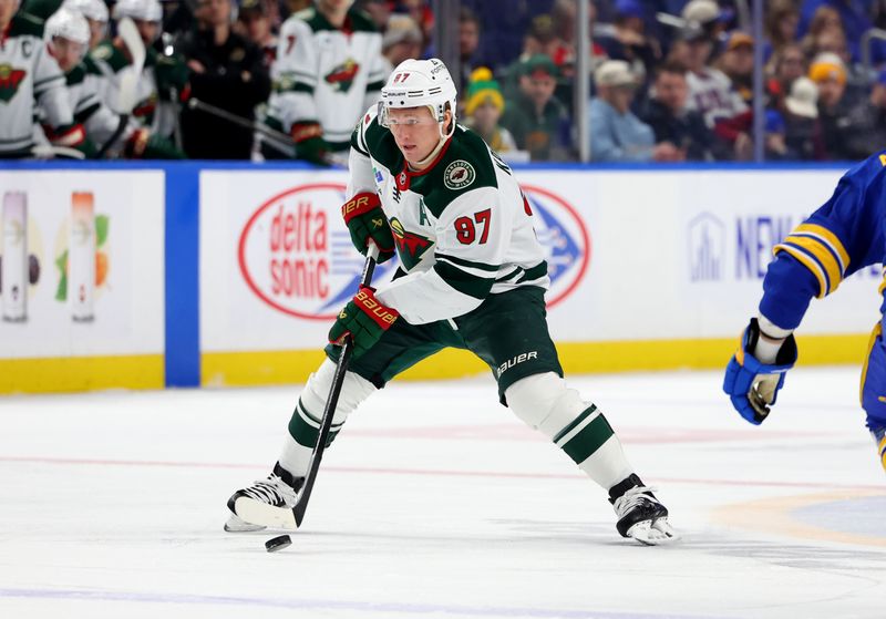 Jan 17, 2026; Buffalo, New York, USA;  Minnesota Wild left wing Kirill Kaprizov (97) looks to make a pass during the first period against the Buffalo Sabres at KeyBank Center. Mandatory Credit: Timothy T. Ludwig-Imagn Images
