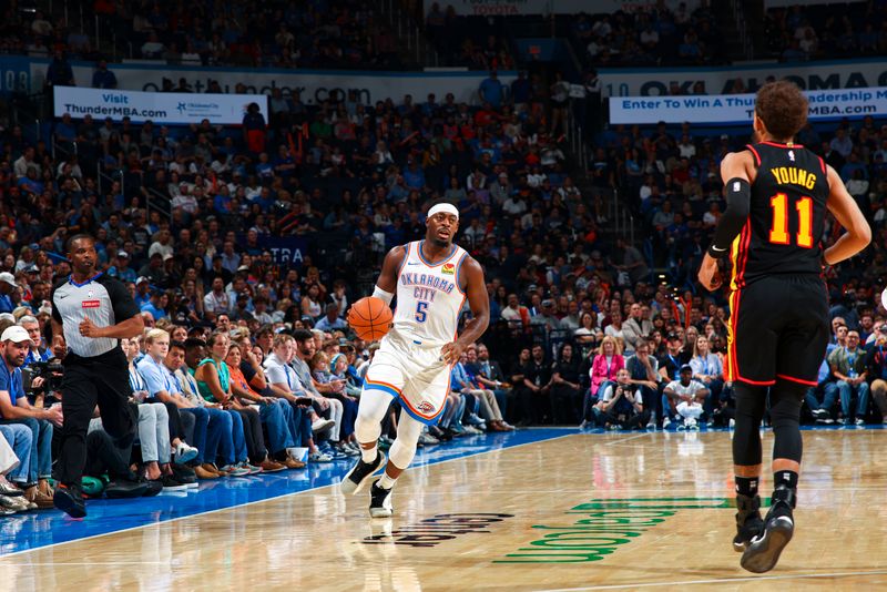 OKLAHOMA CITY, OK - OCTOBER 27: Luguentz Dort #5 of the Oklahoma City Thunder dribbles the ball during the game on October 27, 2024 at Paycom Center in Oklahoma City, Oklahoma. NOTE TO USER: User expressly acknowledges and agrees that, by downloading and or using this photograph, User is consenting to the terms and conditions of the Getty Images License Agreement. Mandatory Copyright Notice: Copyright 2024 NBAE (Photo by Zach Beeker/NBAE via Getty Images)