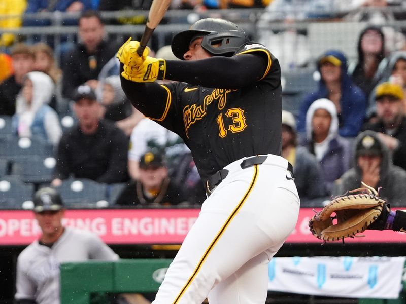                                                                                                                  May 4, 2024; Pittsburgh, Pennsylvania, USA; Pittsburgh Pirates third baseman Ke'Bryan Hayes (13) hits a double against the Colorado Rockies during the sixth inning at PNC Park. Mandatory Credit: Gregory Fisher-USA TODAY Sports