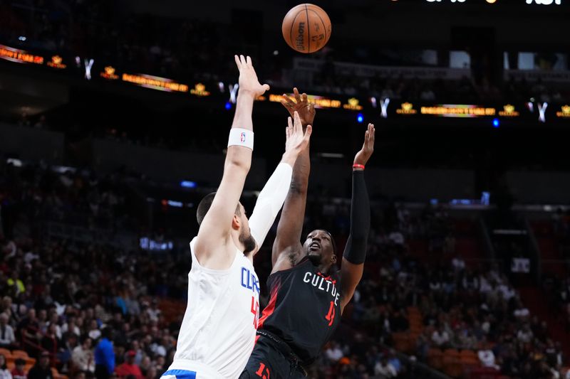 MIAMI, FLORIDA - FEBRUARY 04: Bam Adebayo #13 of the Miami Heat goes up for a shot against Ivica Zubac #40 of the LA Clippers during the first quarter at Kaseya Center on February 04, 2024 in Miami, Florida. User expressly acknowledges and agrees that, by downloading and or using this photograph, User is consenting to the terms and conditions of the Getty Images License Agreement. (Photo by Rich Storry/Getty Images)