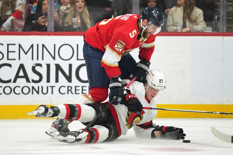 Feb 20, 2024; Sunrise, Florida, USA; Ottawa Senators goaltender Joonas Korpisalo (70) makes a save on a shot by Florida Panthers left wing Jonah Gadjovich (12) during the second period at Amerant Bank Arena. Mandatory Credit: Jim Rassol-USA TODAY Sports