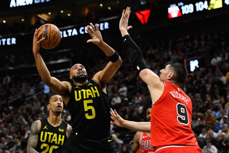 SALT LAKE CITY, UTAH - MARCH 06: Talen Horton-Tucker #5 of the Utah Jazz shoots over Nikola Vucevic #9 of the Chicago Bulls during the second half of a game at Delta Center on March 06, 2024 in Salt Lake City, Utah. NOTE TO USER: User expressly acknowledges and agrees that, by downloading and or using this photograph, User is consenting to the terms and conditions of the Getty Images License Agreement.  (Photo by Alex Goodlett/Getty Images)