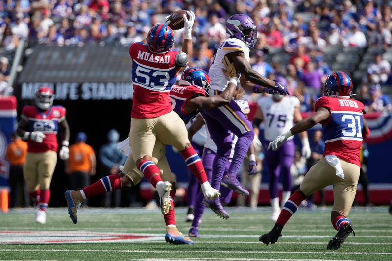 New York Giants linebacker Darius Muasau (53) intercepts a pass during the second half of an NFL football game against the Minnesota Vikings, Sunday, Sept. 8, 2024, in East Rutherford, N.J. (AP Photo/Pamela Smith)