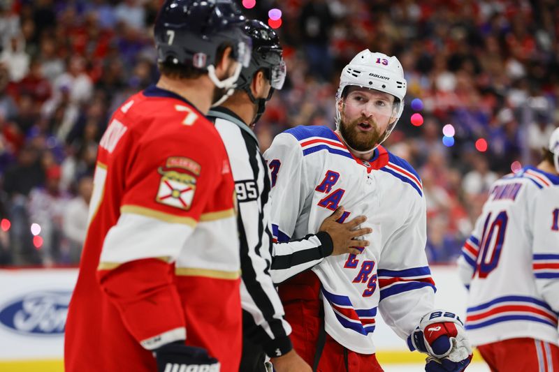 May 28, 2024; Sunrise, Florida, USA; New York Rangers left wing Alexis Lafreniere (13) argues with Florida Panthers defenseman Dmitry Kulikov (7) during the third period in game four of the Eastern Conference Final of the 2024 Stanley Cup Playoffs at Amerant Bank Arena. Mandatory Credit: Sam Navarro-USA TODAY Sports