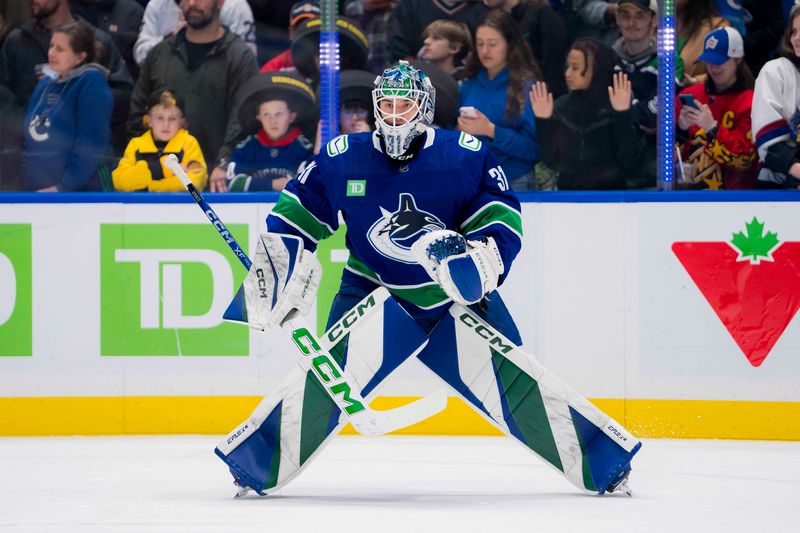 Mar 13, 2024; Vancouver, British Columbia, CAN; Vancouver Canucks goalie Arturs Silvos (31) focuses during warm up prior to a game against the Colorado Avalanche at Rogers Arena. Mandatory Credit: Bob Frid-USA TODAY Sports