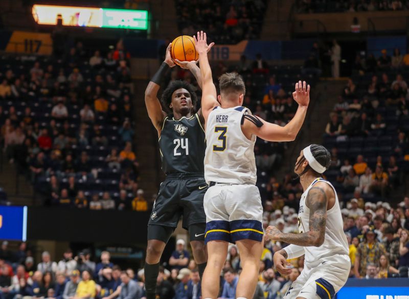 Feb 20, 2024; Morgantown, West Virginia, USA; UCF Knights guard Jaylin Sellers (24) shoots over West Virginia Mountaineers guard Kerr Kriisa (3) during the first half at WVU Coliseum. Mandatory Credit: Ben Queen-USA TODAY Sports