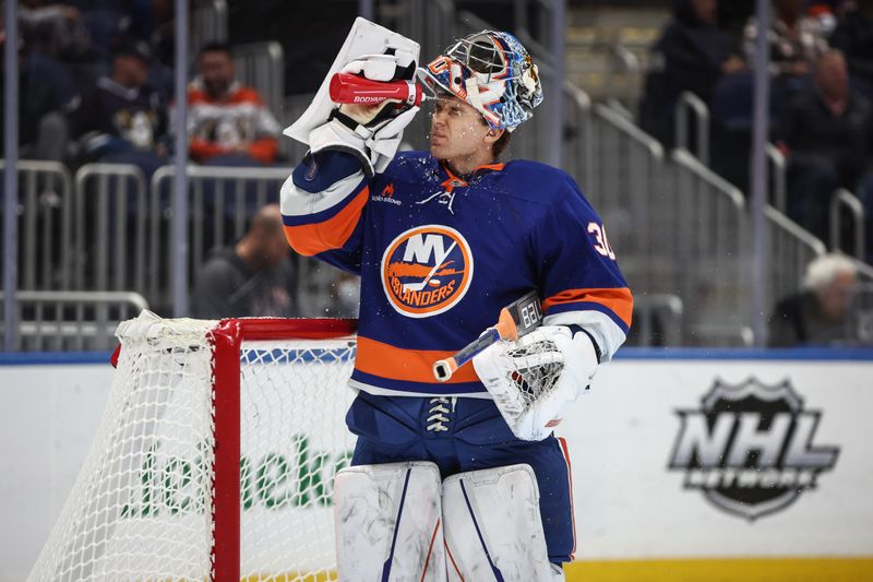 Oct 29, 2024; Elmont, New York, USA;  New York Islanders goaltender Ilya Sorokin (30) splashes water on his face prior to the start of the match against the Anaheim Ducks at UBS Arena. Mandatory Credit: Wendell Cruz-Imagn Images