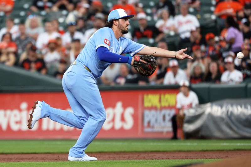 May 2, 2025; Baltimore, Maryland, USA; Kansas City Royals first baseman Vinnie Pasquantino (9) tosses the ball to first base for an out during the second inning against the Baltimore Orioles at Oriole Park at Camden Yards. Mandatory Credit: Daniel Kucin Jr.-Imagn Images