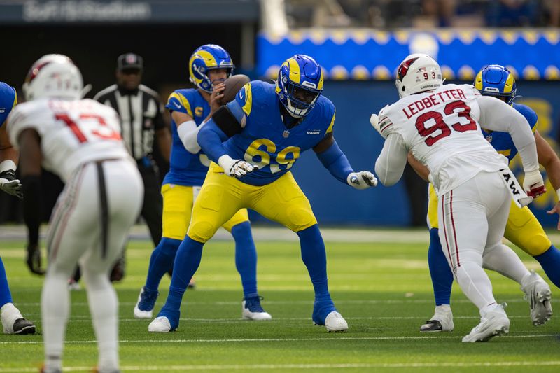 Los Angeles Rams guard Kevin Dotson (69) takes his stance during an NFL football game against the Arizona Cardinals, Sunday, Oct. 15, 2023, in Inglewood, Calif. (AP Photo/Kyusung Gong)