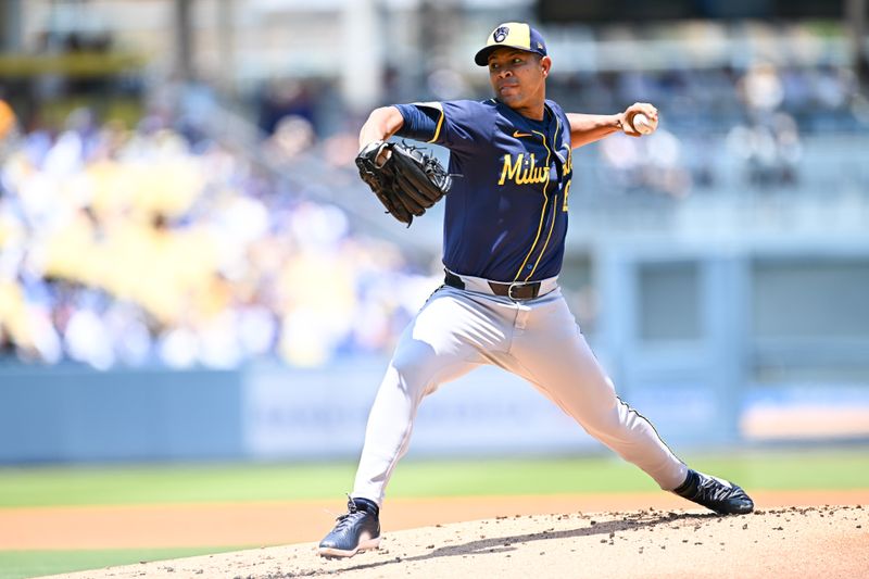 Jul 20, 2025; Los Angeles, California, USA; Milwaukee Brewers starting pitcher Jose Quintana (62) throws a pitch against the Los Angeles Dodgers during the first inning of the game at Dodger Stadium. Mandatory Credit: Jonathan Hui-Imagn Images