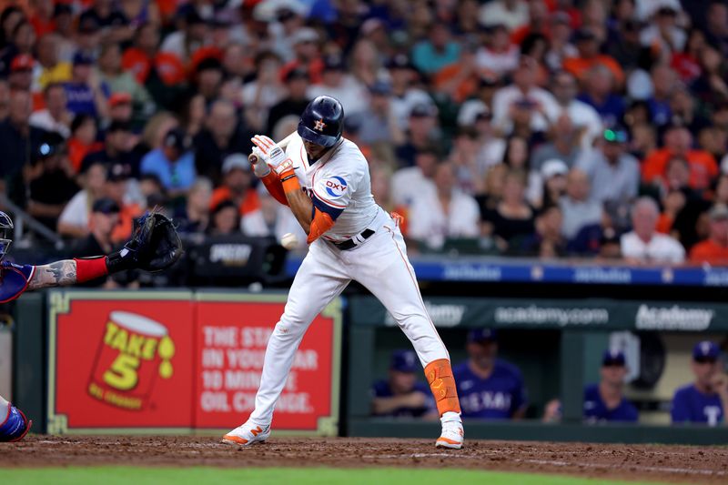 Jul 13, 2024; Houston, Texas, USA; Houston Astros shortstop Jeremy Pena (3) is hit by a pitch against the Texas Rangers during the sixth inning at Minute Maid Park. Mandatory Credit: Erik Williams-USA TODAY Sports