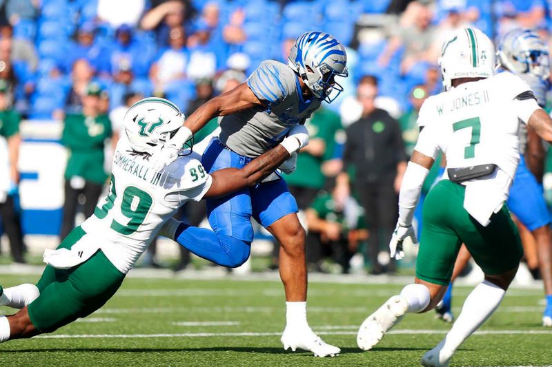 Nov 4, 2023; Memphis, Tennessee, USA;  Memphis Tigers  Blake Watson (4) rushes the ball up the field against South Florida s Lloyd Summerall (99) at Simmons Bank Liberty Stadium. Mandatory Credit: Stu Boyd II-USA TODAY Sports