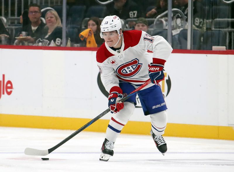 Nov 2, 2024; Pittsburgh, Pennsylvania, USA;  Montreal Canadiens right wing Cole Caufield (13) moves the puck up ice against the Pittsburgh Penguins during the second period at PPG Paints Arena. Mandatory Credit: Charles LeClaire-Imagn Images