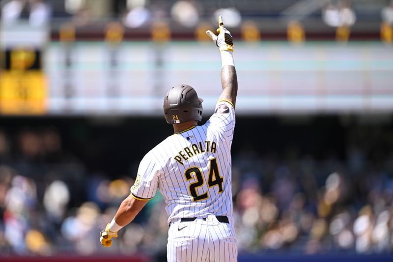 August 14, 2024; San Diego, California, USA; San Diego Padres outfielder David Peralta (24) rounds the bases after hitting a two run home run against the Pittsburgh Pirates during the third inning at Petco Park. Mandatory Credit: Denis Poroy-USA TODAY Sports at Petco Park. 
