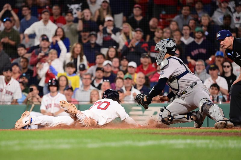 Jun 16, 2024; Boston, Massachusetts, USA; Boston Red Sox shortstop David Hamilton (70) slides home against New York Yankees catcher Jose Trevino (39) on an RBI by catcher Connor Wong (12) (not pictured) during the eighth inning at Fenway Park. Mandatory Credit: Eric Canha-USA TODAY Sports