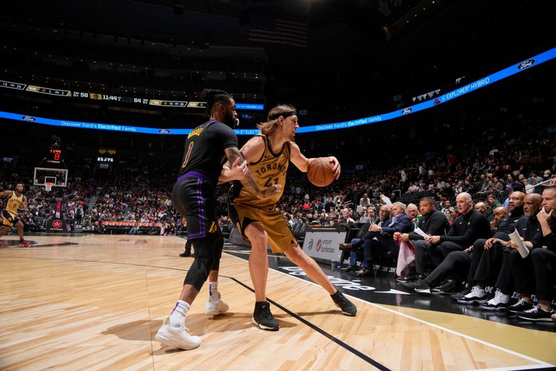 TORONTO, CANADA - APRIL 2: Kelly Olynyk #41 of the Toronto Raptors handles the ball during the game against the Los Angeles Lakers on April 2, 2024 at the Scotiabank Arena in Toronto, Ontario, Canada.  NOTE TO USER: User expressly acknowledges and agrees that, by downloading and or using this Photograph, user is consenting to the terms and conditions of the Getty Images License Agreement.  Mandatory Copyright Notice: Copyright 2024 NBAE (Photo by Mark Blinch/NBAE via Getty Images)