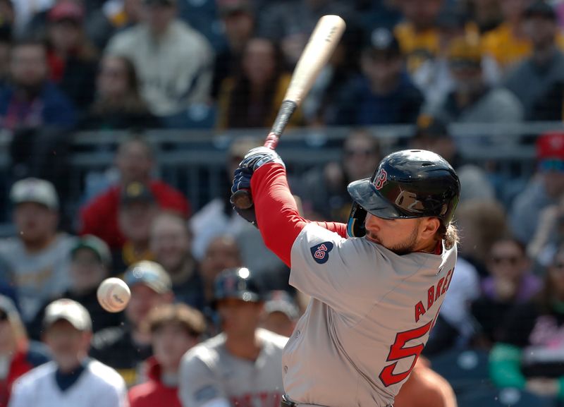 Apr 20, 2024; Pittsburgh, Pennsylvania, USA; Boston Red Sox left fielder Wilyer Abreu (52) hits an RBI infield single against the Pittsburgh Pirates during the first inning at PNC Park. Mandatory Credit: Charles LeClaire-USA TODAY Sports