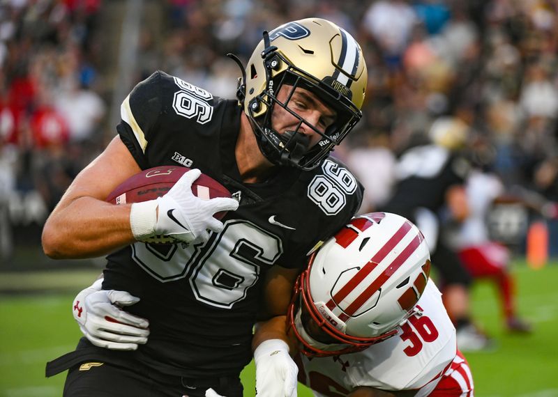 Sep 22, 2023; West Lafayette, Indiana, USA; Purdue Boilermakers tight end Max Allen (86) is tackled by Wisconsin Badgers inside linebacker Jake Chaney (36) during the first half at Ross-Ade Stadium. Mandatory Credit: Robert Goddin-USA TODAY Sports