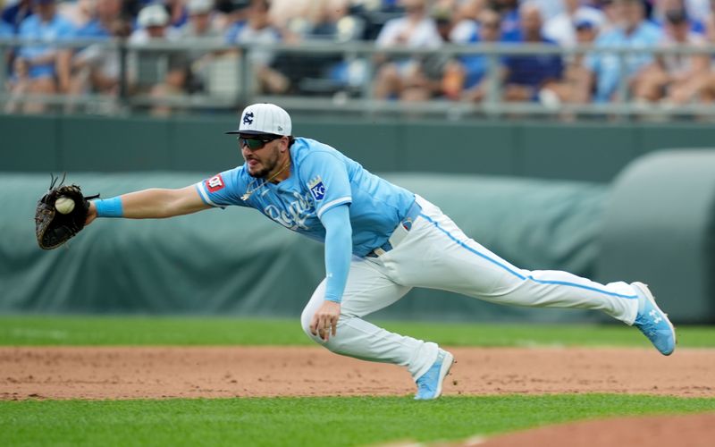 Jul 28, 2024; Kansas City, Missouri, USA; Kansas City Royals first baseman Vinnie Pasquantino (9) dives for a ground ball during the sixth inning against the Chicago Cubs at Kauffman Stadium. Mandatory Credit: Jay Biggerstaff-USA TODAY Sports