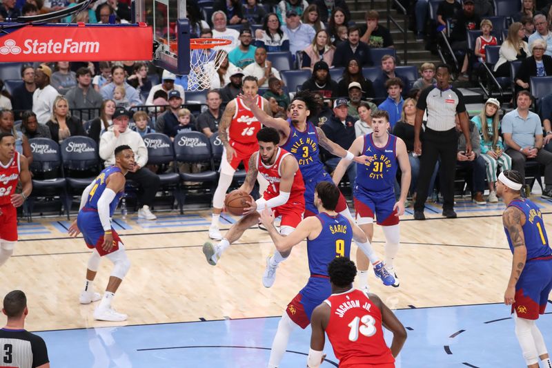 MEMPHIS, TN - NOVEMBER 17: Scotty Pippen Jr. #1 of the Memphis Grizzlies drives to the basket during the game against the Denver Nuggets on November 17, 2024 at FedExForum in Memphis, Tennessee. NOTE TO USER: User expressly acknowledges and agrees that, by downloading and or using this photograph, User is consenting to the terms and conditions of the Getty Images License Agreement. Mandatory Copyright Notice: Copyright 2024 NBAE (Photo by Joe Murphy/NBAE via Getty Images)