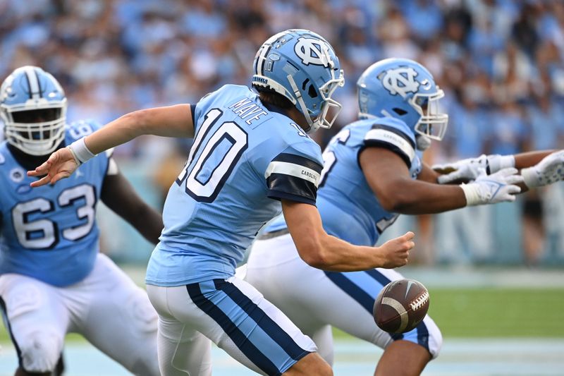 Sep 24, 2022; Chapel Hill, North Carolina, USA; North Carolina Tar Heels quarterback Drake Maye (10) fumbles the ball in the third quarter at Kenan Memorial Stadium. Mandatory Credit: Bob Donnan-USA TODAY Sports