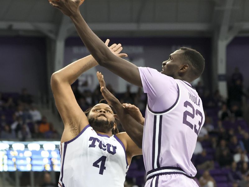 Jan 14, 2023; Fort Worth, Texas, USA;  Kansas State Wildcats center Abayomi Iyiola (23) shoots over TCU Horned Frogs center Eddie Lampkin Jr. (4) during the second half at Ed and Rae Schollmaier Arena. Mandatory Credit: Kevin Jairaj-USA TODAY Sports