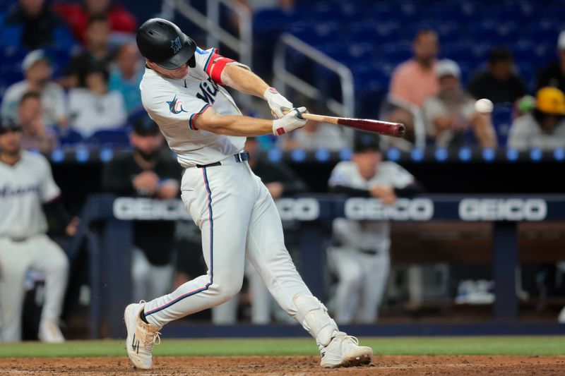 Jun 4, 2025; Miami, Florida, USA; Miami Marlins first baseman Eric Wagaman (33) hits a ground-rule double against the Colorado Rockies during the seventh inning at loanDepot Park. Mandatory Credit: Sam Navarro-Imagn Images