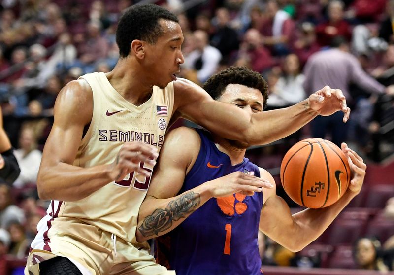 Jan 28, 2023; Tallahassee, Florida, USA; Clemson Tigers guard Chase Hunter (1) is fouled by Florida State Seminoles guard Matthew Cleveland (35) during the second half at Donald L. Tucker Center. Mandatory Credit: Melina Myers-USA TODAY Sports