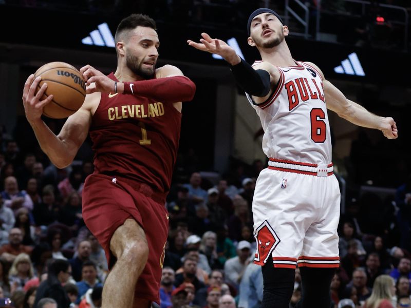 CLEVELAND, OH - FEBRUARY 14: Max Strus #1 of the Cleveland Cavaliers rebounds against Alex Caruso #6 of the Chicago Bulls during the second half at Rocket Mortgage Fieldhouse on February 14, 2024 in Cleveland, Ohio. NOTE TO USER: User expressly acknowledges and agrees that, by downloading and or using this photograph, User is consenting to the terms and conditions of the Getty Images License Agreement. (Photo by Ron Schwane/Getty Images)