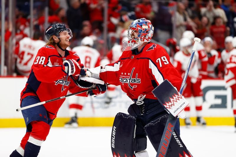 Mar 26, 2024; Washington, District of Columbia, USA; Washington Capitals goaltender Charlie Lindgren (79) celebrates with Washington Capitals defenseman Rasmus Sandin (38) after defeating the Detroit Red Wings in overtime at Capital One Arena. Mandatory Credit: Amber Searls-USA TODAY Sports