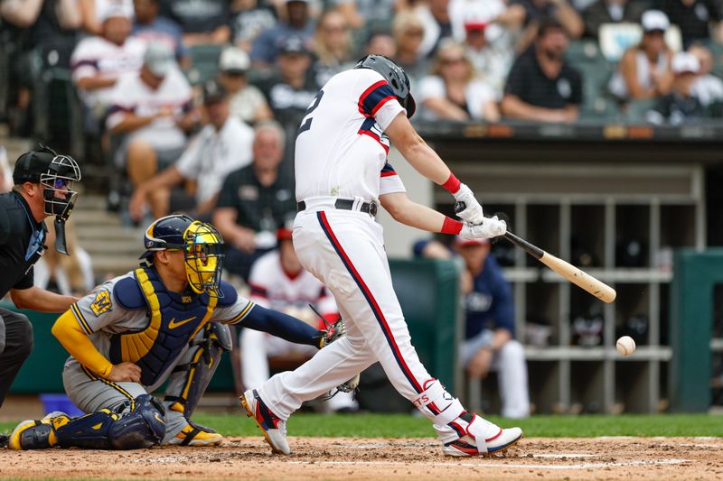 Aug 13, 2023; Chicago, Illinois, USA; Chicago White Sox right fielder Gavin Sheets (32) singles against the Milwaukee Brewers during the fourth inning at Guaranteed Rate Field. Mandatory Credit: Kamil Krzaczynski-USA TODAY Sports