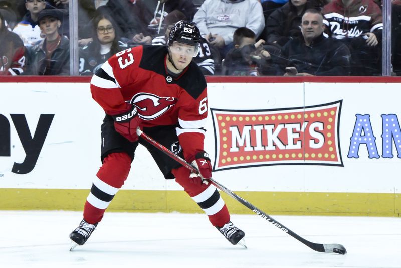 Feb 12, 2024; Newark, New Jersey, USA; New Jersey Devils left wing Jesper Bratt (63) skates with the puck during the second period against the Seattle Kraken at Prudential Center. Mandatory Credit: John Jones-USA TODAY Sports