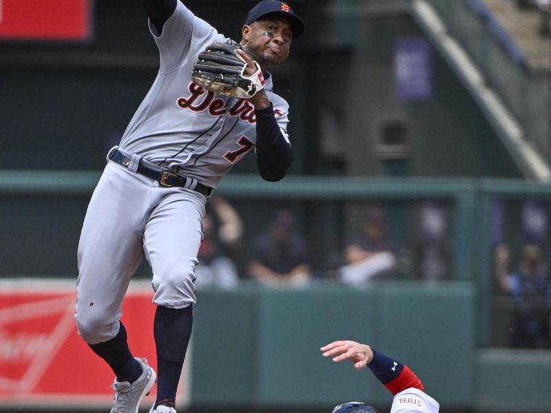 May 7, 2023; St. Louis, Missouri, USA;  Detroit Tigers second baseman Jonathan Schoop (7) leaps over St. Louis Cardinals left fielder Brendan Donovan (33) and he trows to first during the second inning at Busch Stadium. Mandatory Credit: Jeff Curry-USA TODAY Sports