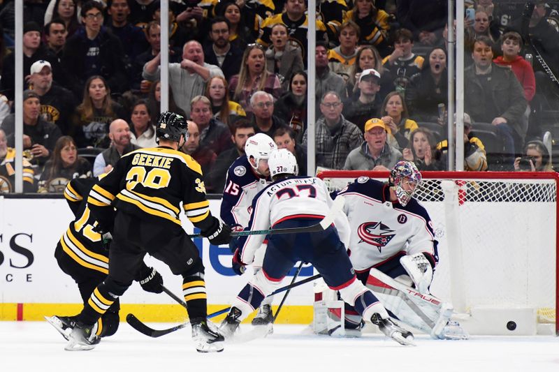 Nov 18, 2024; Boston, Massachusetts, USA;  Boston Bruins center Charlie Coyle (13) scores a goal past Columbus Blue Jackets goaltender Elvis Merzlikins (90) during the second period at TD Garden. Mandatory Credit: Bob DeChiara-Imagn Images