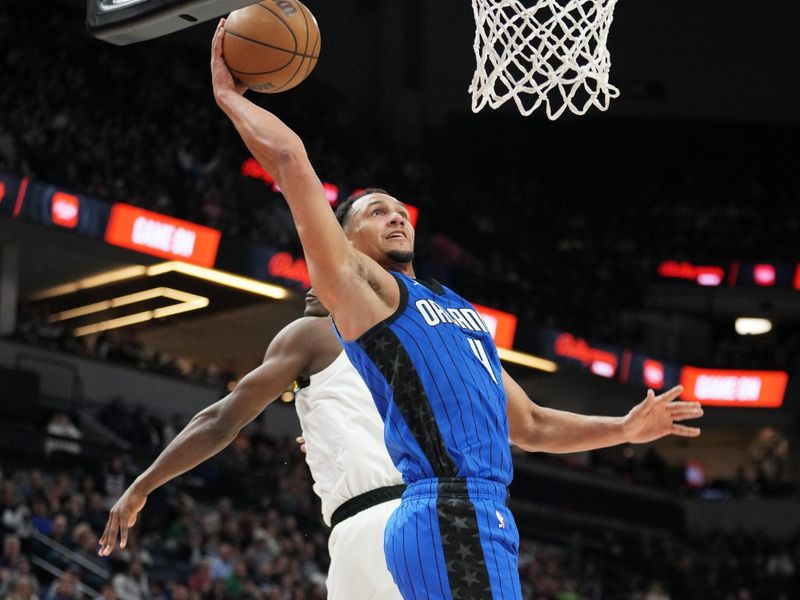 MINNEAPOLIS, MN -  FEBRUARY 3:  Jalen Suggs #4 of the Orlando Magic drives to the basket during the game against the Minnesota Timberwolves on February 3, 2023 at Target Center in Minneapolis, Minnesota. NOTE TO USER: User expressly acknowledges and agrees that, by downloading and or using this Photograph, user is consenting to the terms and conditions of the Getty Images License Agreement. Mandatory Copyright Notice: Copyright 2022 NBAE (Photo by Jordan Johnson/NBAE via Getty Images)