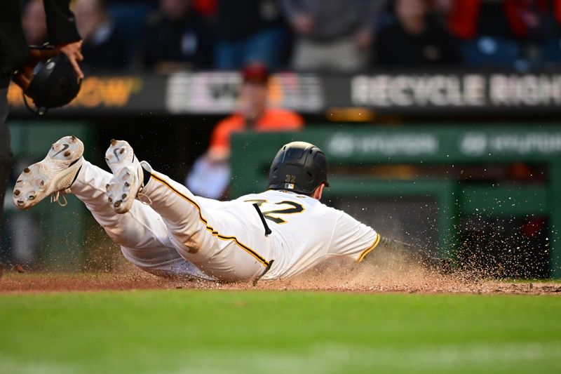 Apr 6, 2024; Pittsburgh, Pennsylvania, USA; Pittsburgh Pirates catcher Henry Davis (32) scores the game winning run during the eleventh inning against the Baltimore Orioles at PNC Park. Mandatory Credit: David Dermer-USA TODAY Sports