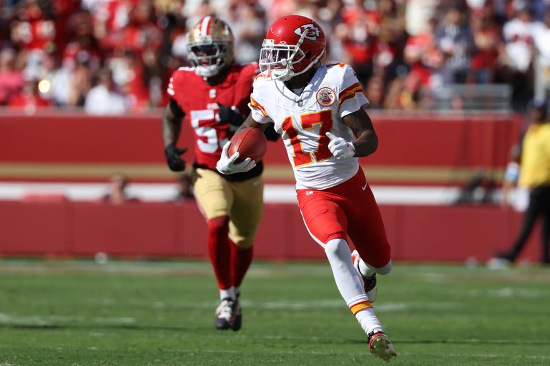 Kansas City Chiefs wide receiver Mecole Hardman (17) runs in front of San Francisco 49ers linebacker Dee Winters (53) during the first half of an NFL football game in Santa Clara, Calif., Sunday, Oct. 20, 2024. (AP Photo/Jed Jacobsohn)