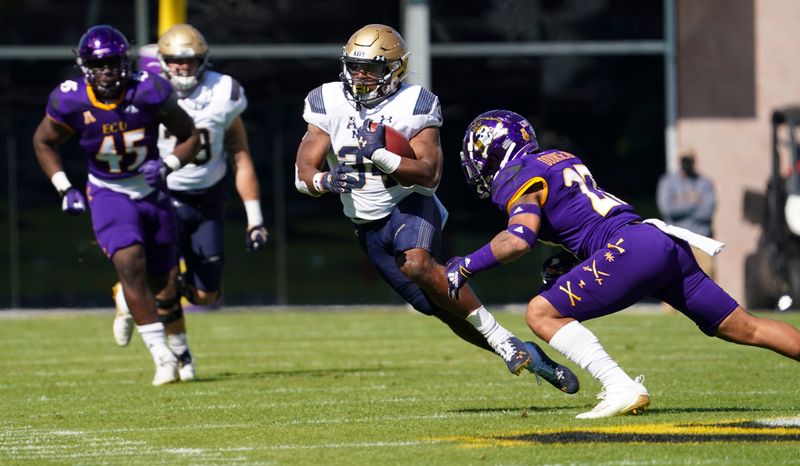 Oct 17, 2020; Greenville, North Carolina, USA;  Navy Midshipmen fullback Jamale Carothers (34) runs with the ball during the first half against the East Carolina Pirates at Dowdy-Ficklen Stadium. Mandatory Credit: James Guillory-USA TODAY Sports