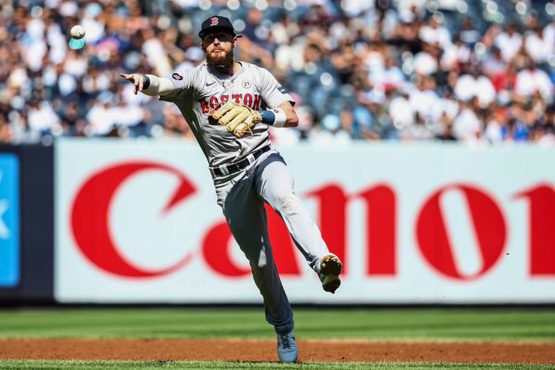 Sep 15, 2024; Bronx, New York, USA;  Boston Red Sox shortstop Trevor Story (10) throws to first in the 1st inning against the New York Yankees at Yankee Stadium. Mandatory Credit: Wendell Cruz-Imagn Images