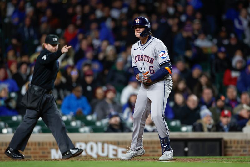 Apr 24, 2024; Chicago, Illinois, USA; Houston Astros outfielder Jake Meyers (6) is hit by a pitch from Chicago Cubs relief pitcher Adbert Alzolay during the fifth inning at Wrigley Field. Mandatory Credit: Kamil Krzaczynski-USA TODAY Sports
