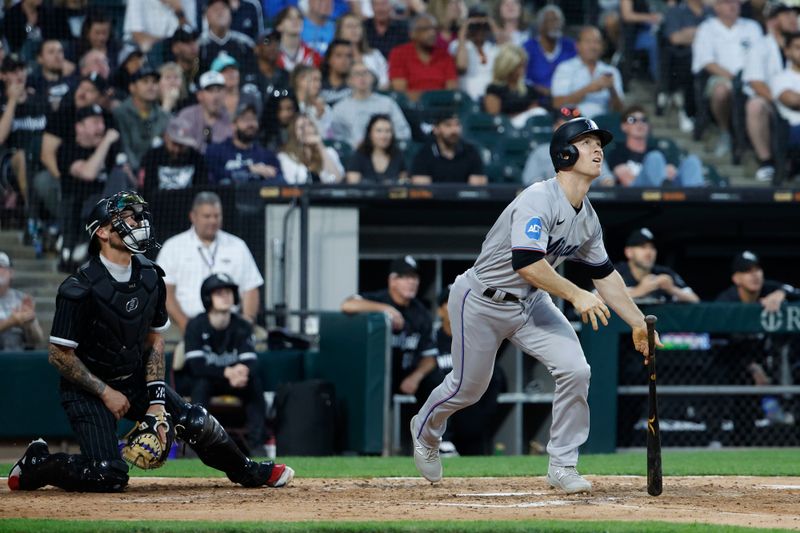 Jun 9, 2023; Chicago, Illinois, USA; Miami Marlins shortstop Joey Wendle (18) watches his solo home run against the Chicago White Sox during the fifth inning at Guaranteed Rate Field. Mandatory Credit: Kamil Krzaczynski-USA TODAY Sports