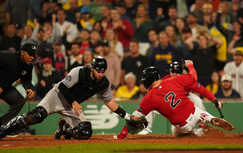 Jun 14, 2023; Boston, Massachusetts, USA; Boston Red Sox designated hitter Justin Turner (2) safe at home plate against Colorado Rockies catcher Austin Wynns (16) in the seventh inning at Fenway Park. Mandatory Credit: David Butler II-USA TODAY Sports