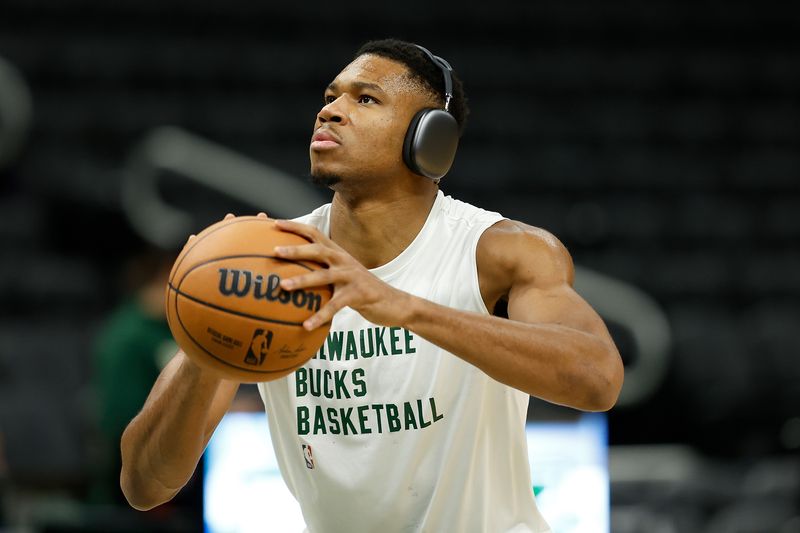 MILWAUKEE, WISCONSIN - OCTOBER 20: Giannis Antetokounmpo #34 of the Milwaukee Bucks warms up before the preseason game against the Memphis Grizzlies at Fiserv Forum on October 20, 2023 in Milwaukee, Wisconsin. NOTE TO USER: User expressly acknowledges and agrees that, by downloading and or using this photograph, User is consenting to the terms and conditions of the Getty Images License Agreement. (Photo by John Fisher/Getty Images)