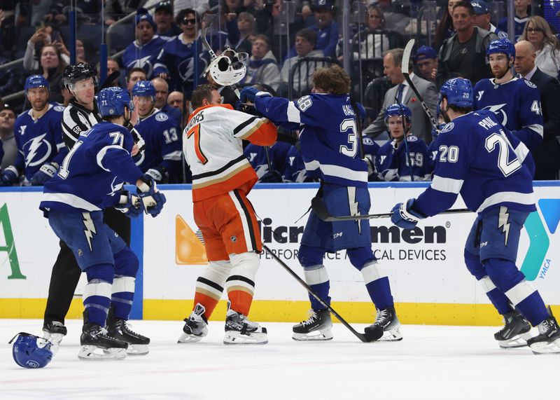 Jan 16, 2025; Tampa, Florida, USA;  Anaheim Ducks defenseman Radko Gudas (7) and Tampa Bay Lightning left wing Brandon Hagel (38) fight during the second period at Amalie Arena. Mandatory Credit: Kim Klement Neitzel-Imagn Images