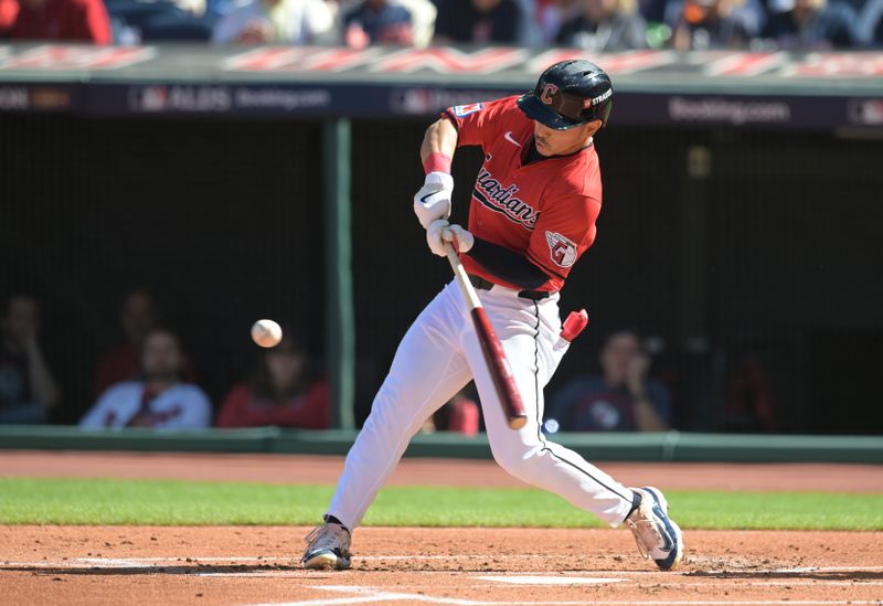 Oct 5, 2024; Cleveland, OH, USA; Cleveland Guardians outfielder Steven Kwan (38) hits a double in the first inning against the Detroit Tigers in game one of the ALDS for the 2024 MLB Playoffs at Progressive Field. Mandatory Credit: Ken Blaze-Imagn Images